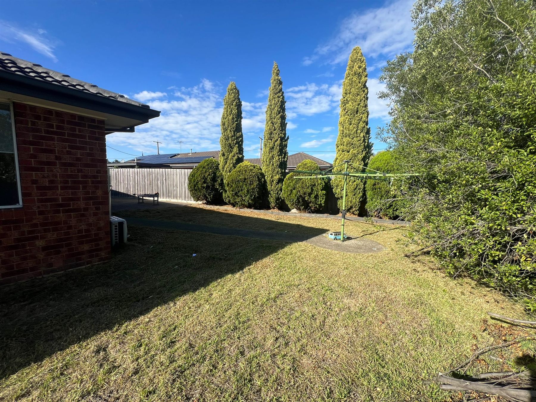Lawn and shaped shrubs maintained by FreshCut Garden and Maintenance